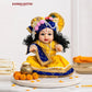 Laddu Gopal Kanha Ji Soft Doll with Peacock Feather Mukut, Blue Pagdi & Yellow Silk Poshak – Pearl Mala Decorative Silicone Idol for Home Mandir & Gifting